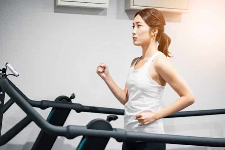 Asian Woman Walking on the Best Manual Treadmill