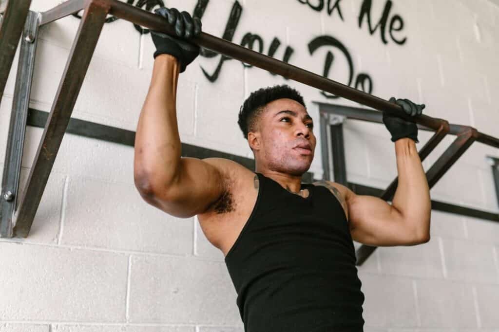 A guy doing pull ups at home