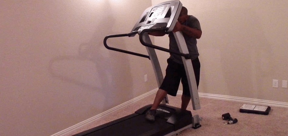 One Person struggling on How to Take Apart a Proform Treadmill
