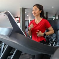 An Asian Woman Running on the Best NordicTrack Treadmill